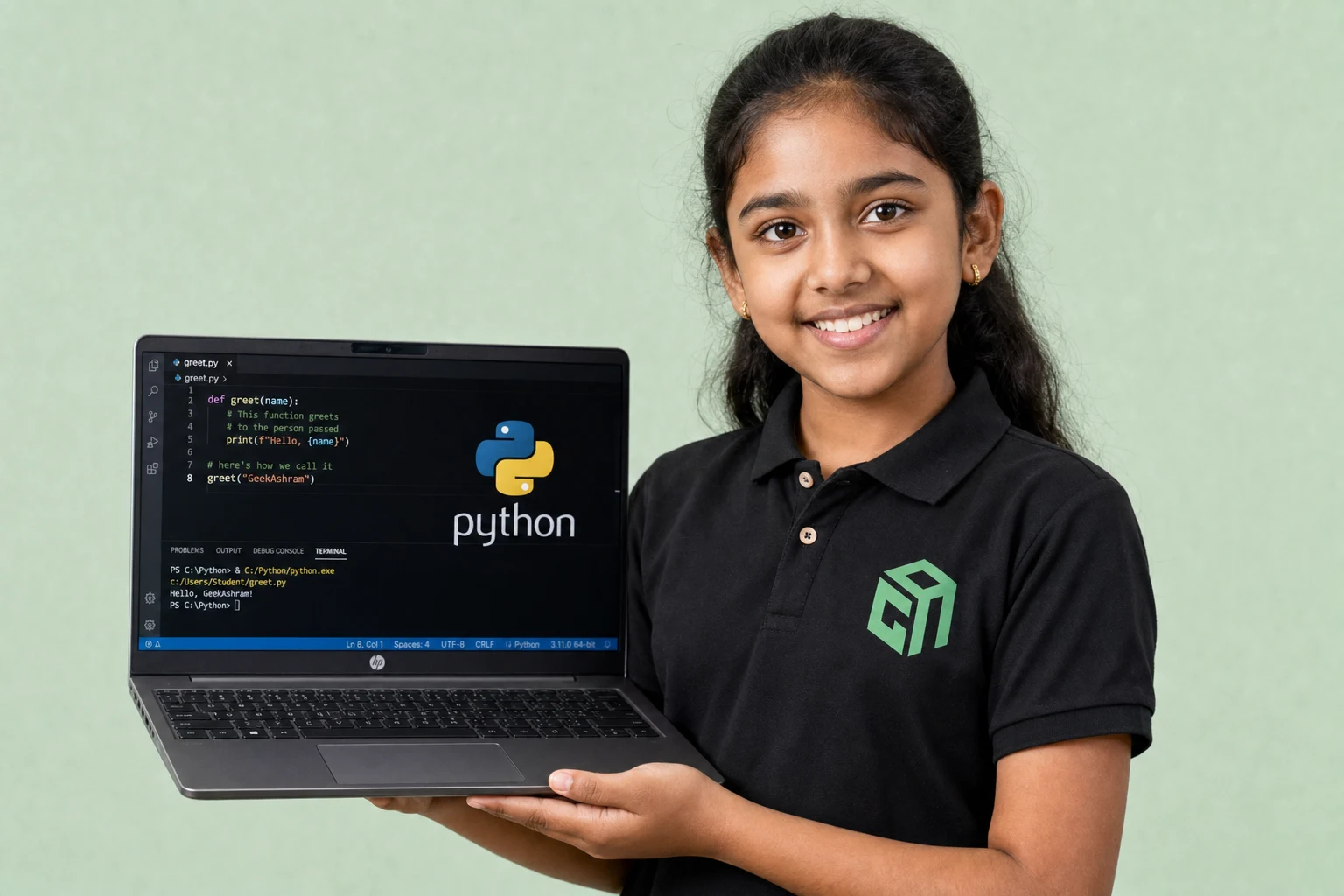 GeekashramJr student in black Geekashram polo learning Python programming and artificial intelligence